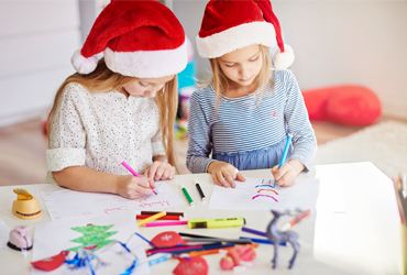 Preschool kids doing creative craftwork using paper and colors